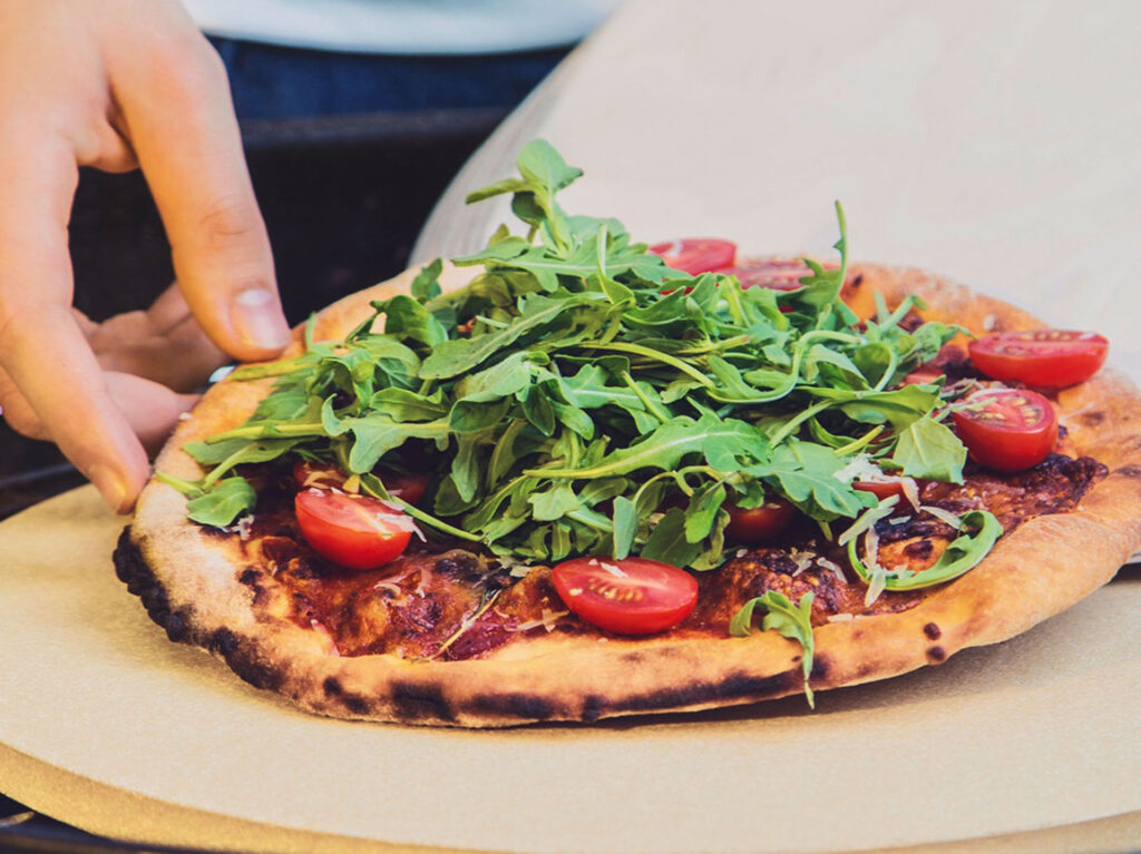 How do I use a pizza stone correctly?