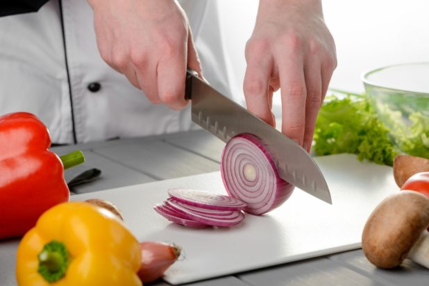 Chef,Cutting,A,Red,Onion,Into,Ring,Slices.,Cooking,A